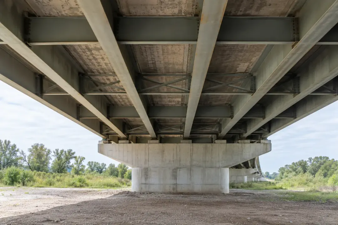 Underside of a bridge deck showing main girders and cross-members.