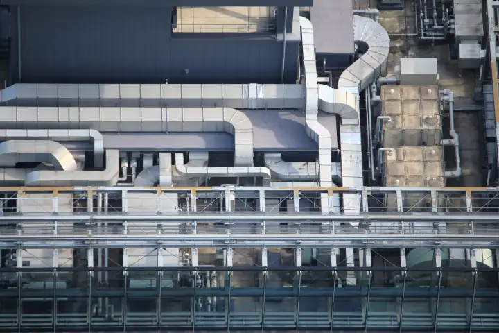 Galvanized ventilation ducts and mechanical equipment on an office-building rooftop