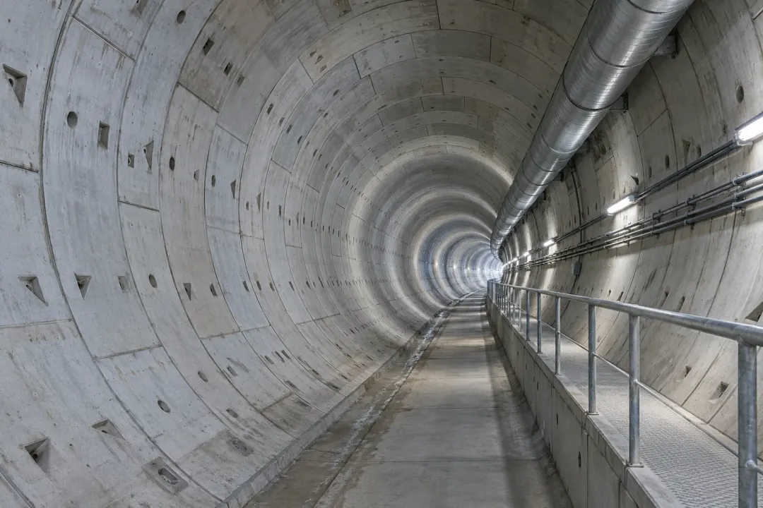 Application illustration: Segmental concrete tunnel lining with visible joints and a service walkway.